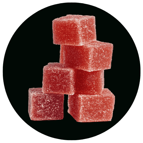 Sugar cubes stacked in a pyramid against a black background, highlighting sweet treats and food photography.