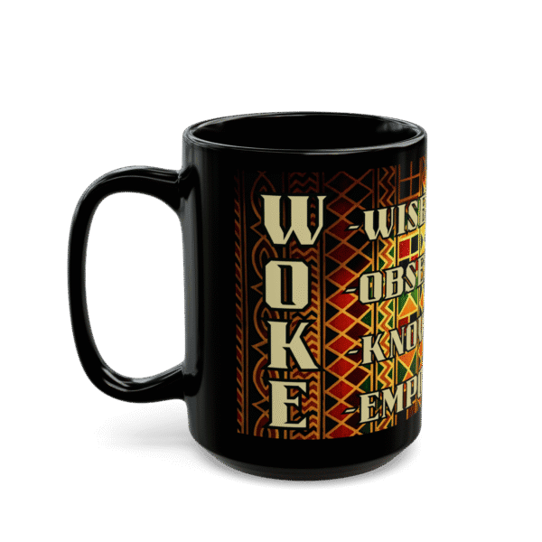 A black ceramic mug features vibrant African-inspired geometric patterns and inspirational words like "WOKE," "OBVIOUS," "KNOW," and "EMPOWER" for daily motivation.